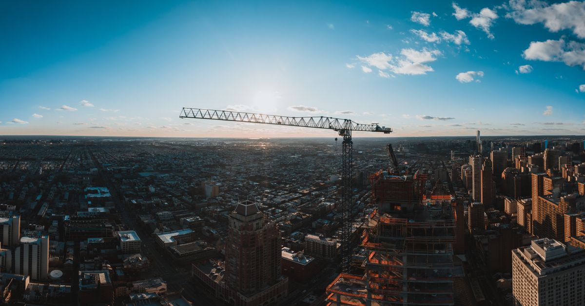 billionaire investor looking at real estate assets and infrastructure projects