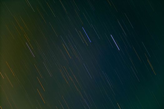 Beautiful long exposure of star trails across the dark night sky over West Java, Indonesia.