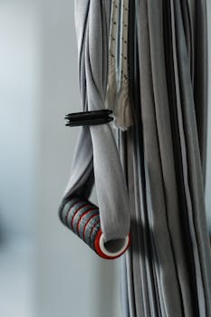 Gray aerial yoga equipment with handlebar, ideal for exercise setups.