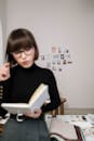 Woman Holding Book in Interior Design Office