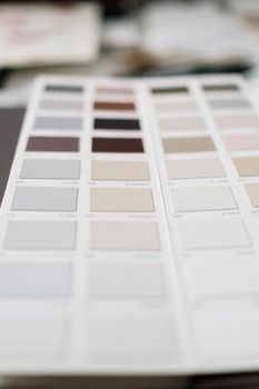Close-up of a neutral color palette sample sheet showcasing various swatches in soft tones.. pexels, close, neutral