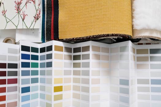 A variety of fabric swatches alongside a detailed color palette for design inspiration.. variety, fabric, swatches