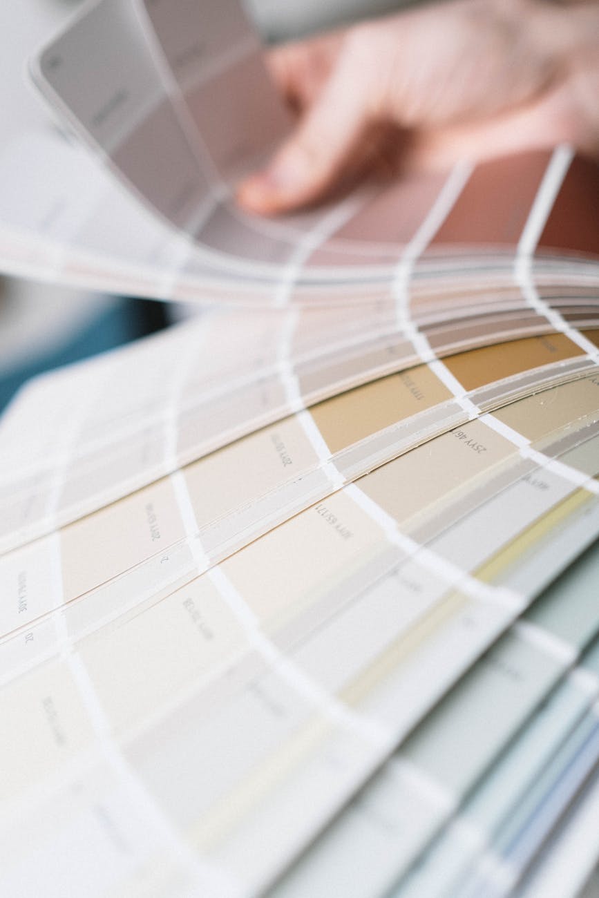 Detailed close-up of a multi-colored color swatch palette being fanned out for interior design selection.
