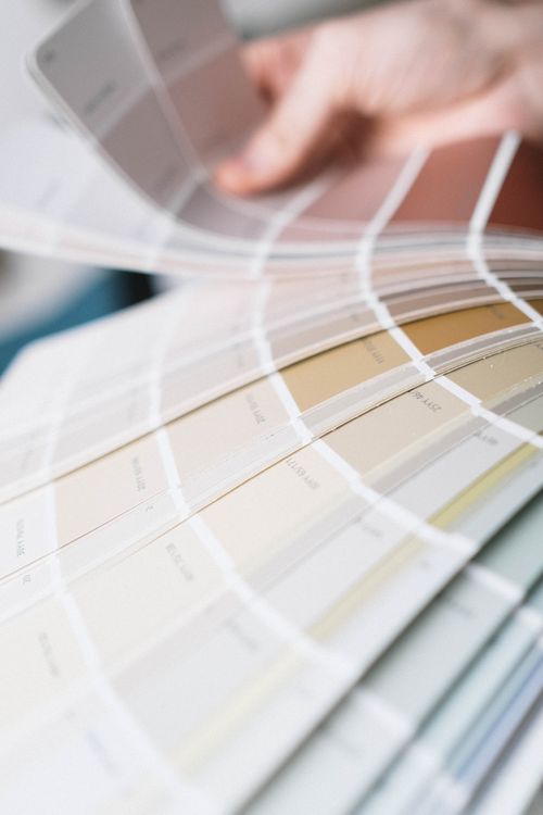 Free Detailed close-up of a multi-colored color swatch palette being fanned out for interior design selection. Stock Photo