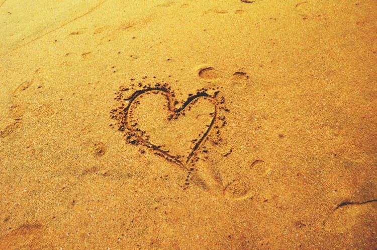 Heart Drawing On Brown Sand