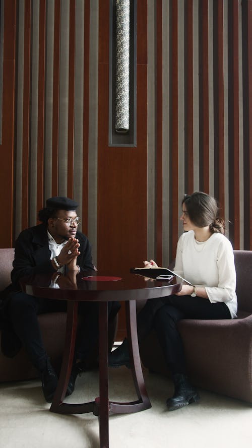 Free Man and Woman Having a Conversation Stock Photo