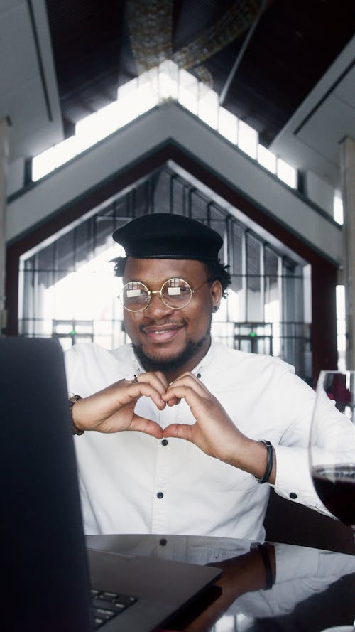 Man in White Dress Shirt Wearing Eyeglasses