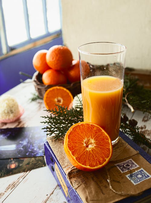 Free Orange Juice in Clear Drinking Glass Stock Photo