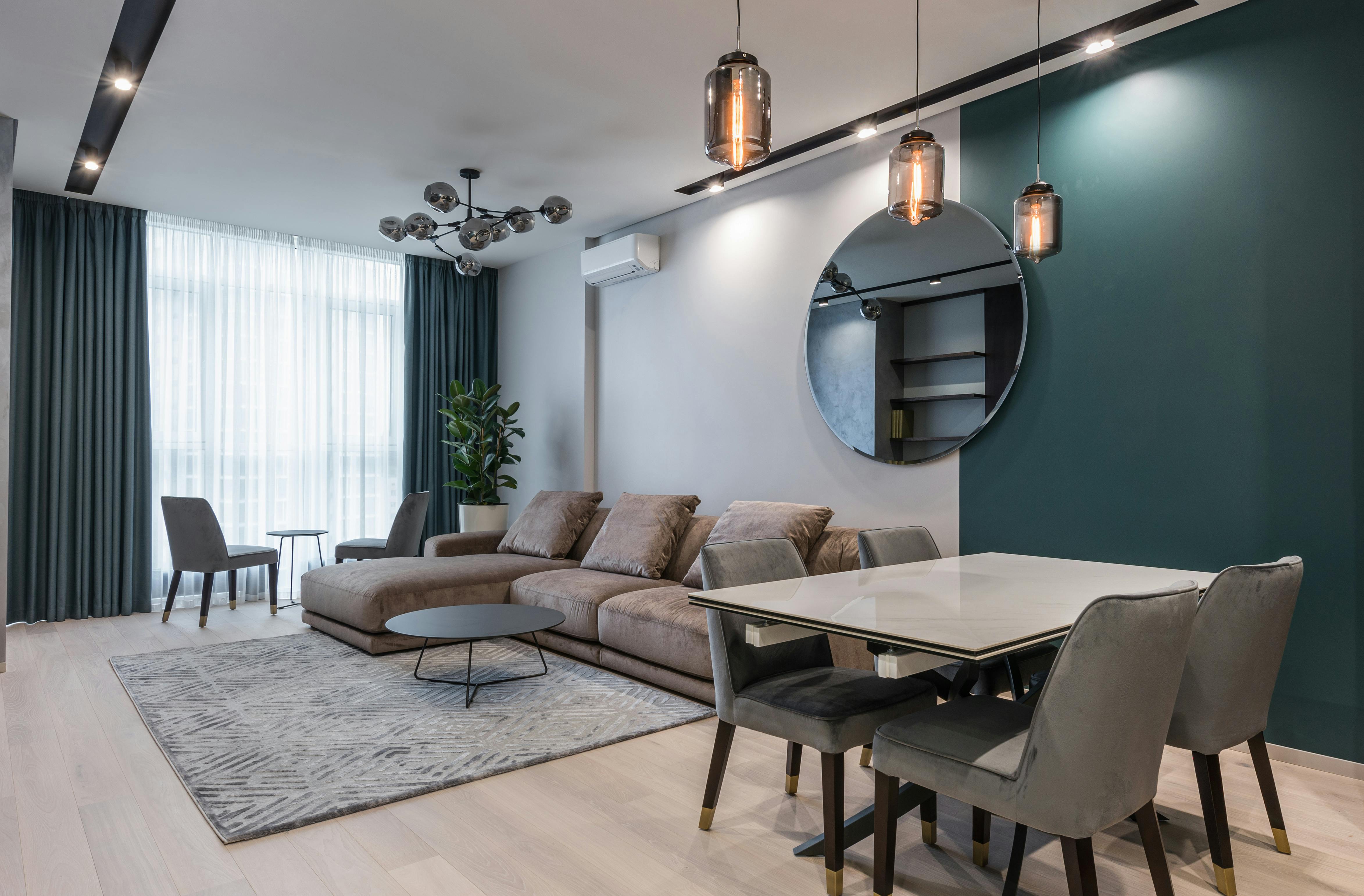 Cozy sofa and table with chairs in contemporary living room