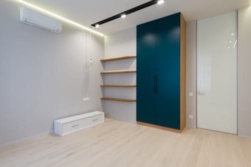 Interior of modern room with wooden cabinet and shelves