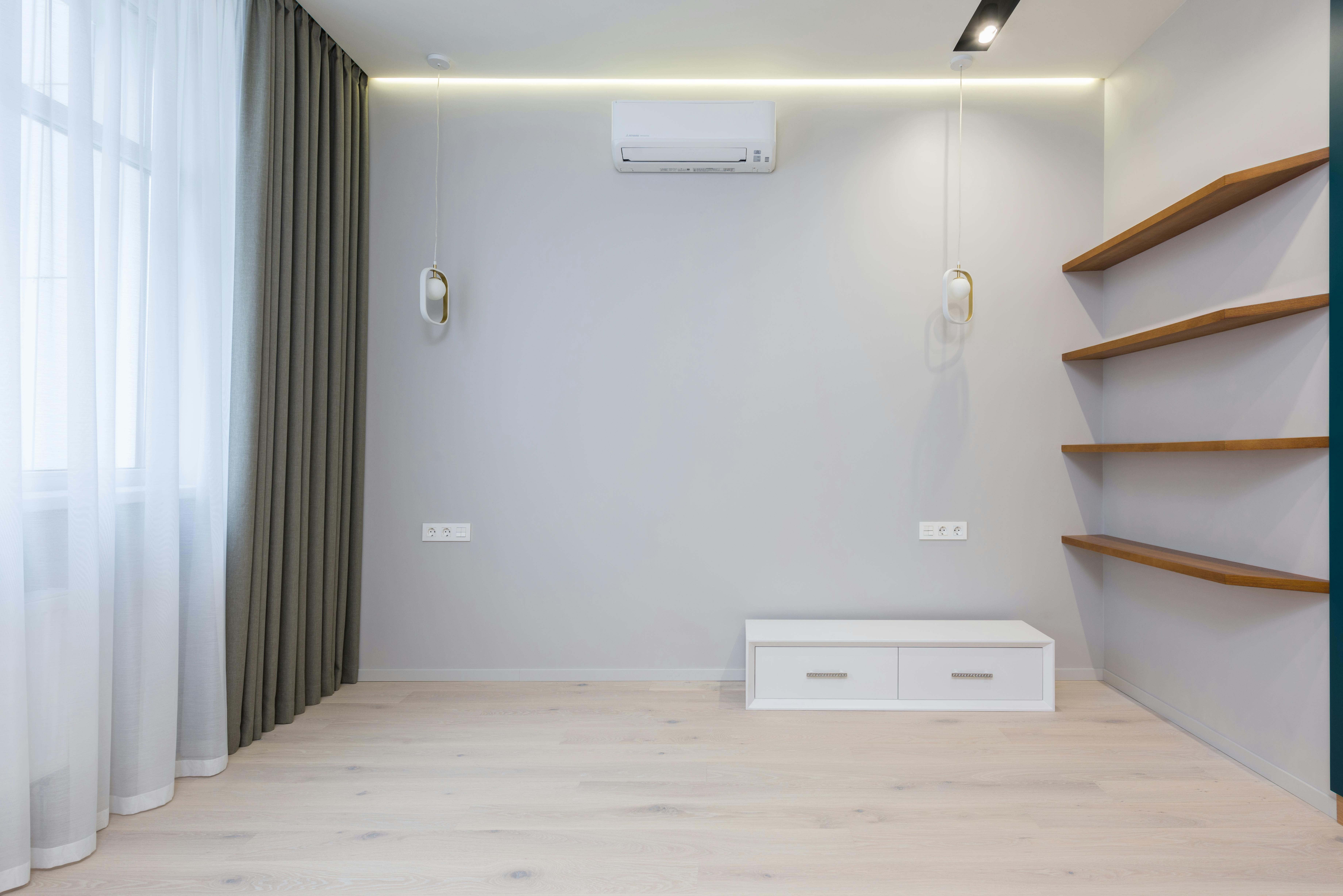 interior of minimalist room with wooden shelves and ac