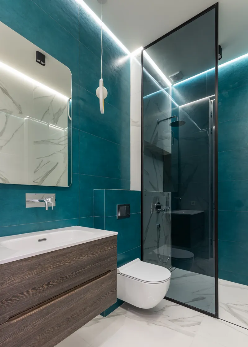 Frameless floor-to-ceiling glass shower enclosure