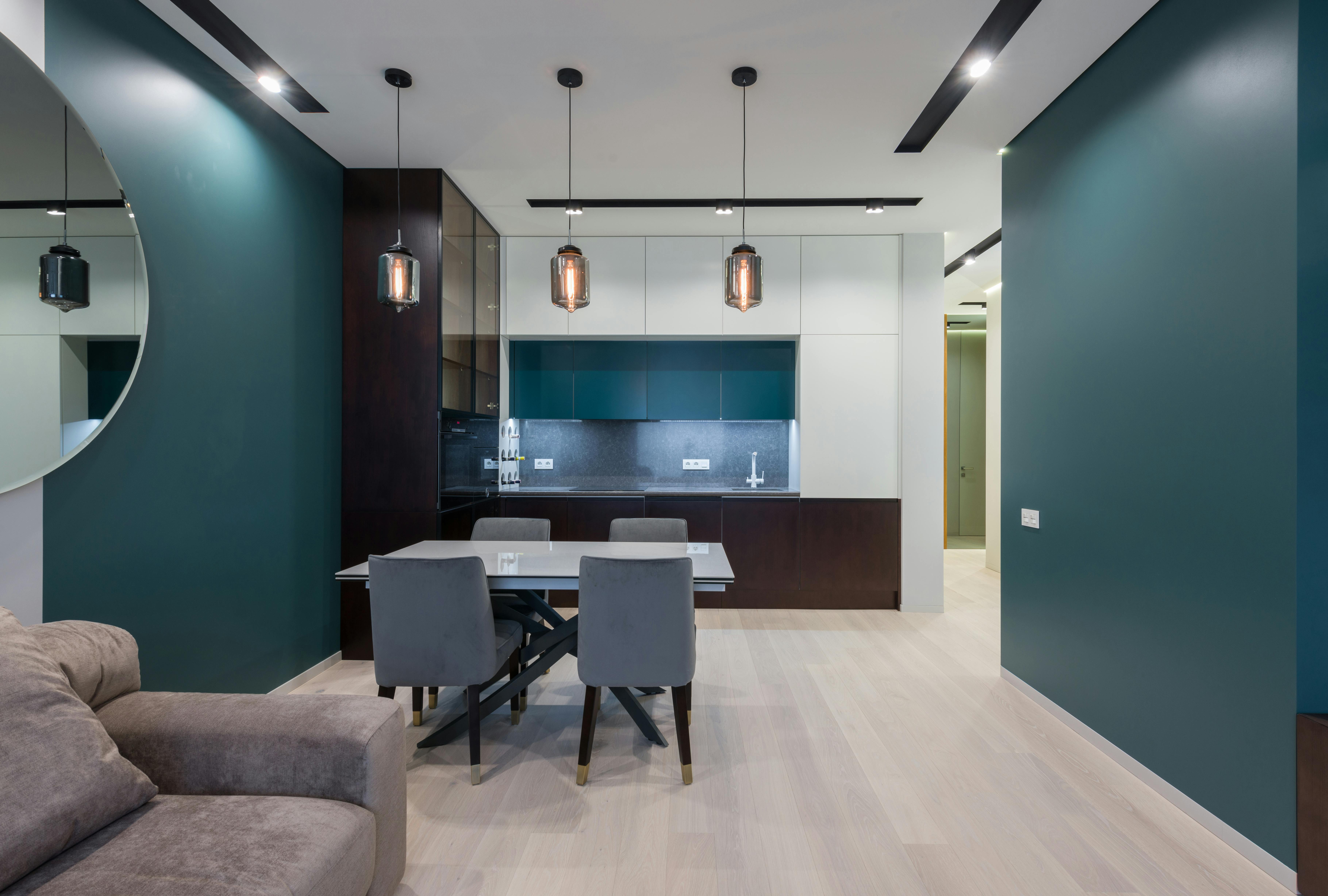 stylish interior of studio apartment with kitchen and living room