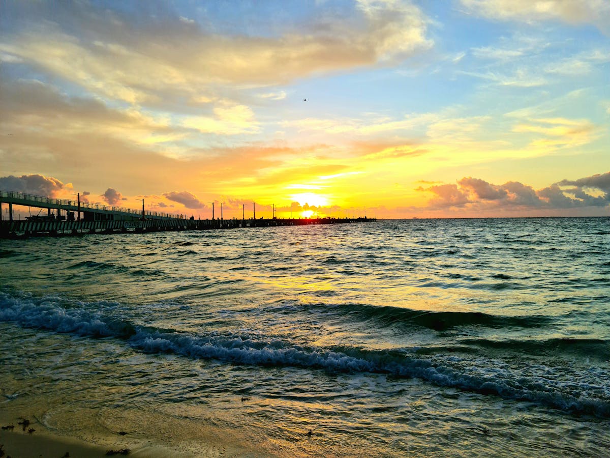 Cozy minimalist bedroom with layered neutral bedding and natural textures