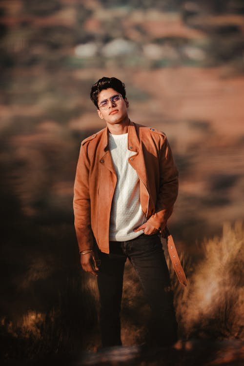 Man in Brown Jacket Wearing Eyeglasses 