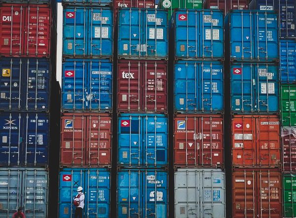 Stacked cargo containers at shipping yard