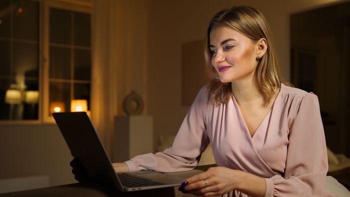 Person using a calculator to plan loan budget
