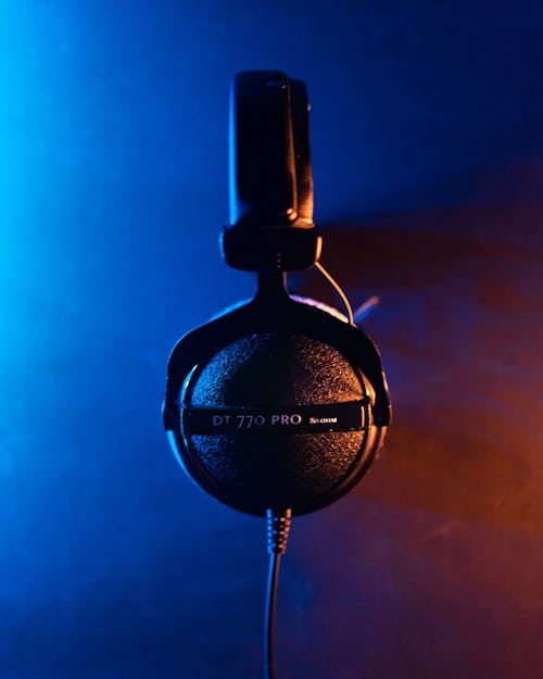 Free Black Headphones on Blue Background Stock Photo
