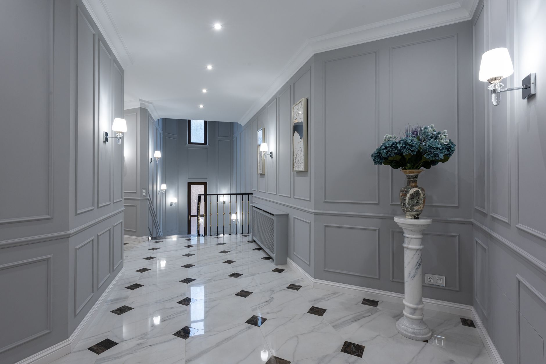Material-rich hallway with artwork and polished stone floor