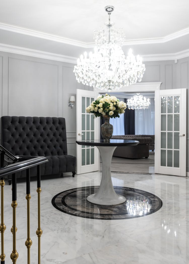 Classic Interior Of Luxury House Hallway Decorated With Crystal Chandelier And Flowers Vase