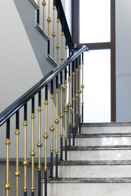 Free Low angle of marble stairway with metal golden banister in classic styled villa in daylight Stock Photo