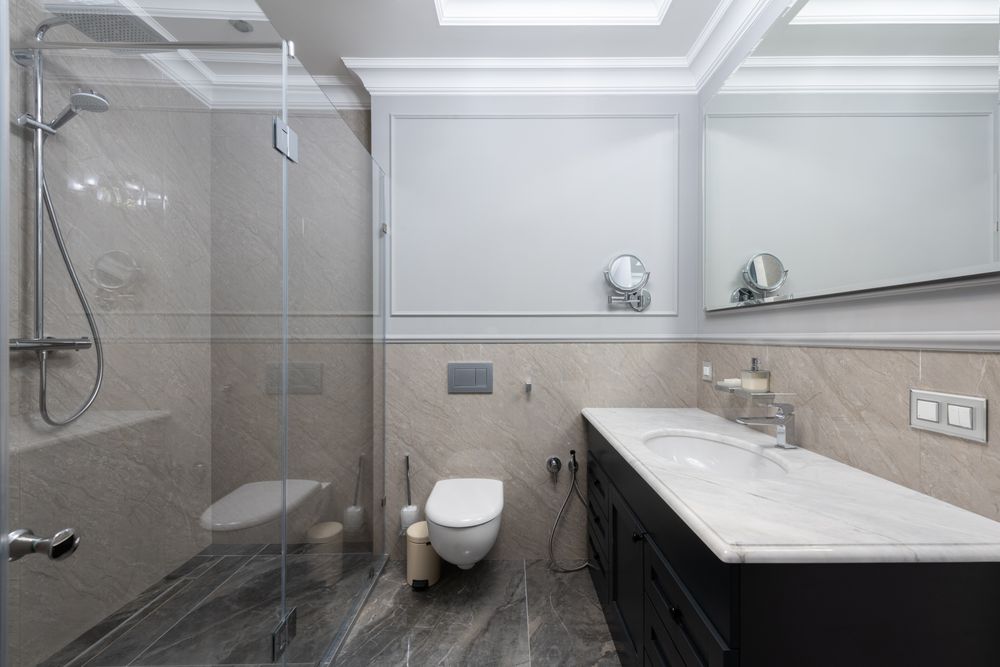 Hillsborough Master Bath — glass shower cabin beside custom marble vanity with mirror