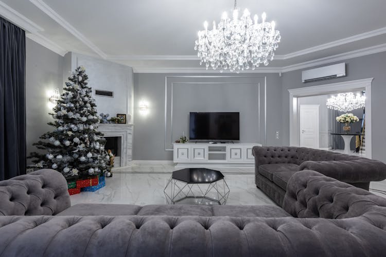 Large Soft Sofa In Modern Lounge With Christmas Tree