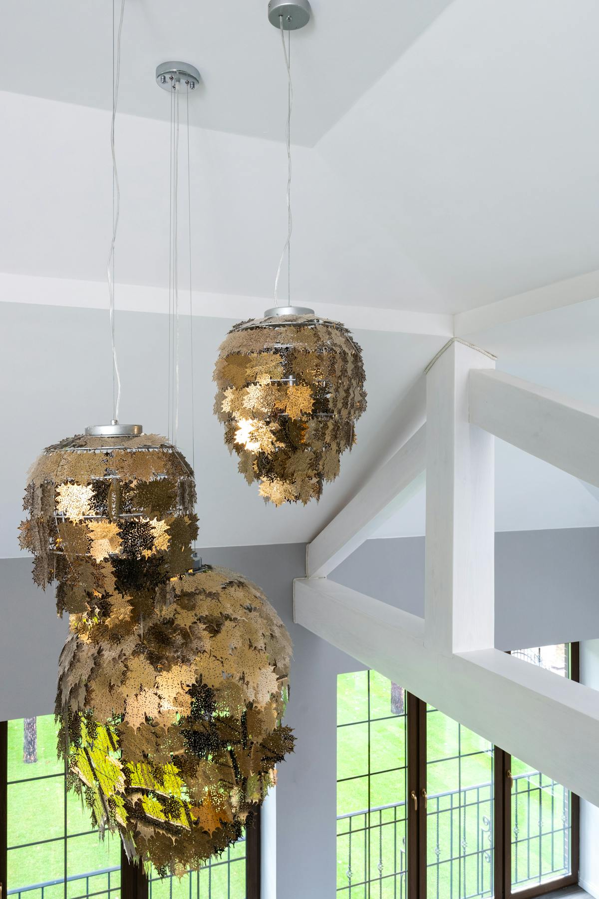 Modern living room with sculptural light and cozy neutral decor