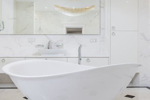 Oval shaped white bathtub in contemporary bathroom