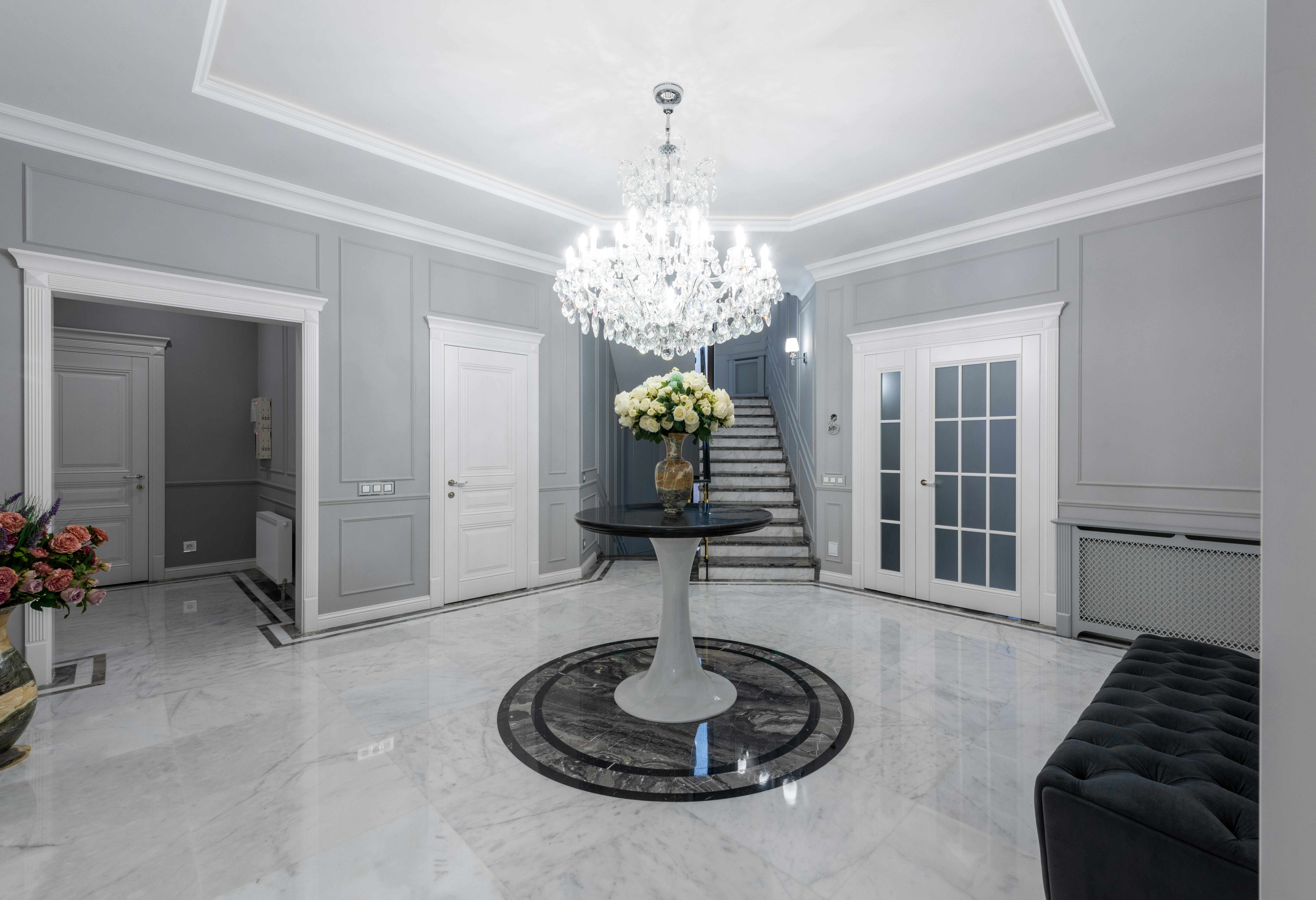 Luxurious foyer with dramatic lighting and stone elements