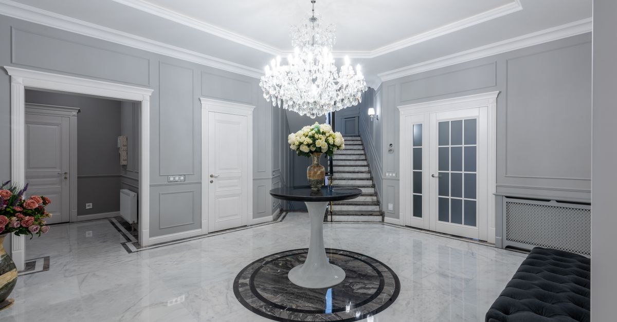 Classic contemporary hall with table decorated with blooming flowers ...
