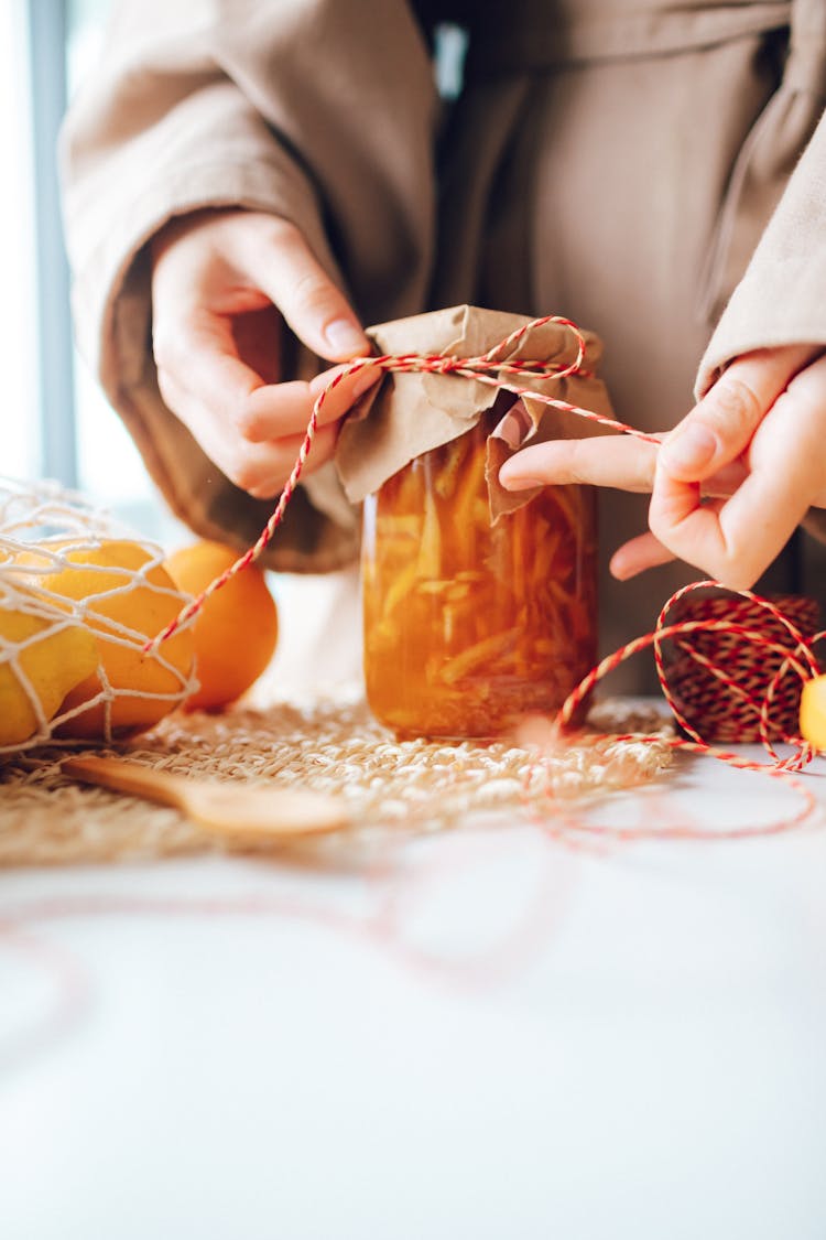 Woman Packing Homemade Jam