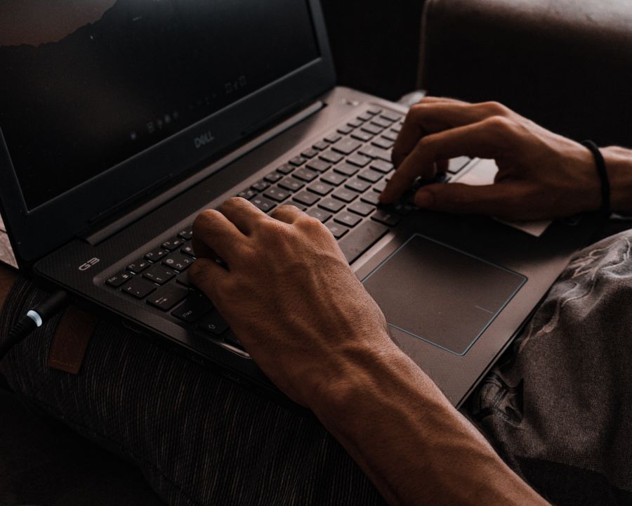 Student working through a practical exercise on a laptop during a live class