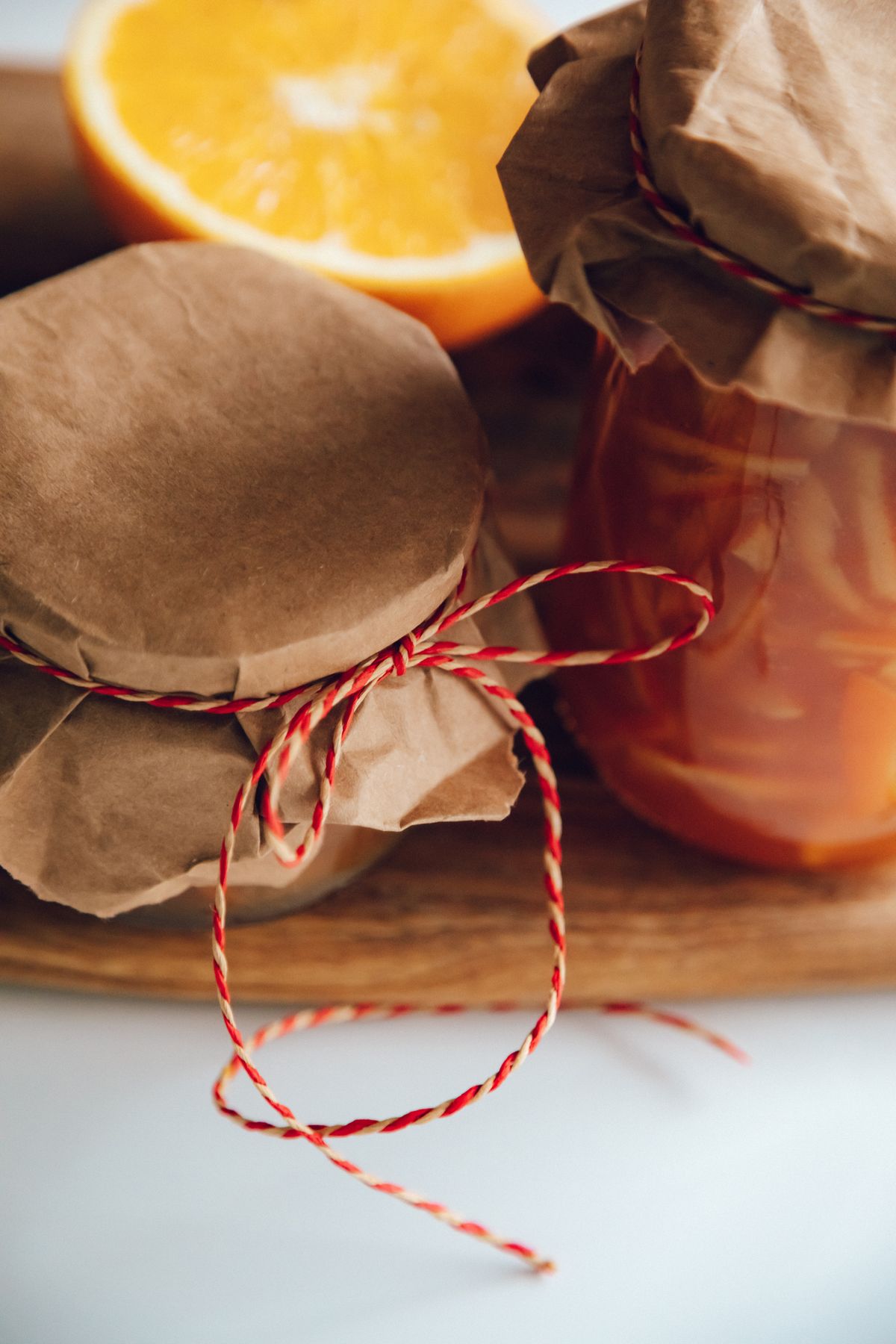 Homemade jars of preserves on a pantry shelf for spice storage ideas