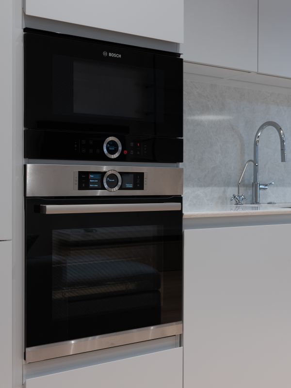 Built-in electric range and microwave oven in a contemporary kitchen