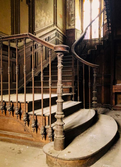 Free Explore the intricate details of an abandoned wooden staircase, rich with history and character. Stock Photo