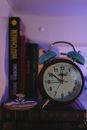 An Alarm Clock on Top of the Books