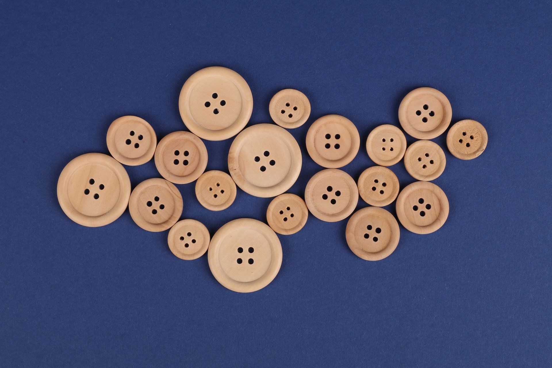 Wooden Buttons on a Blue Surface