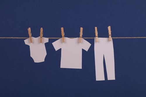 Paper Cutout Baby Clothes on a Clothes Line