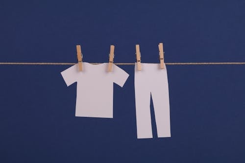 Free Paper Clothes Hanging on Clothes Line Stock Photo