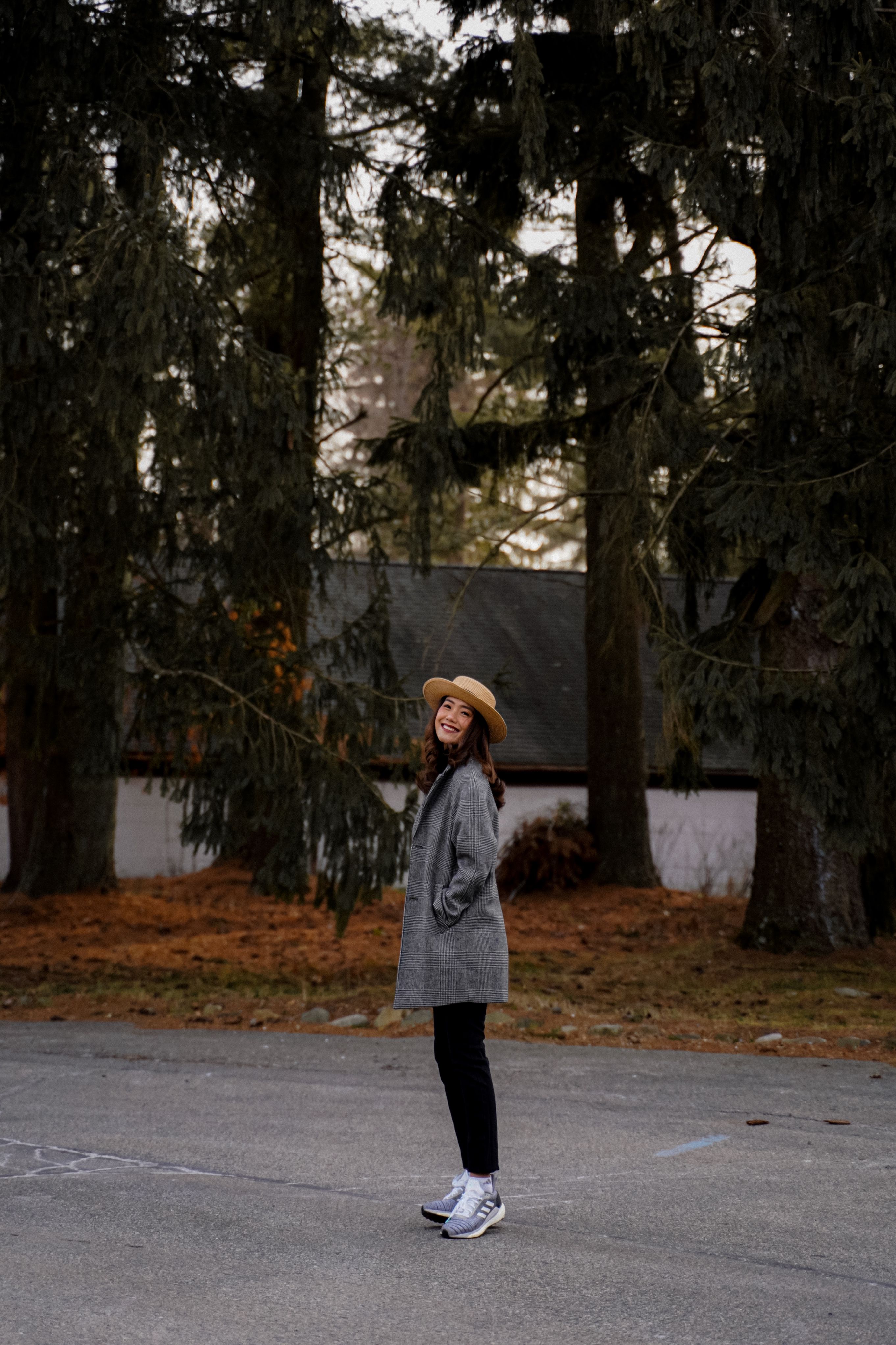 Photo of a Woman in a Brown Coat Dancing · Free Stock Photo