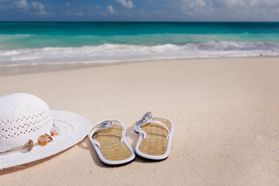 White Hat Beside White Flip Flops Near Short