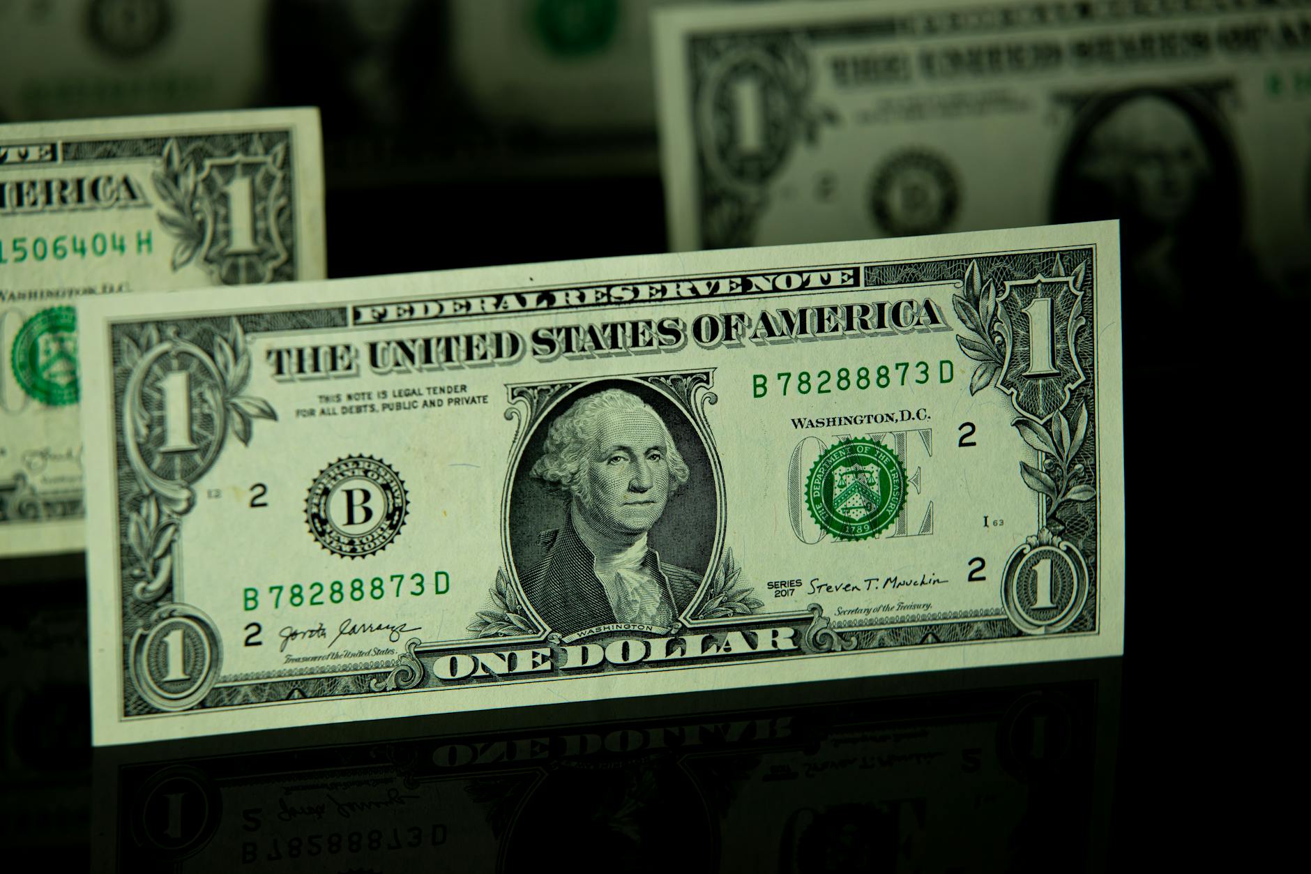 Detailed shot of a one dollar bill highlighting currency and finance themes.