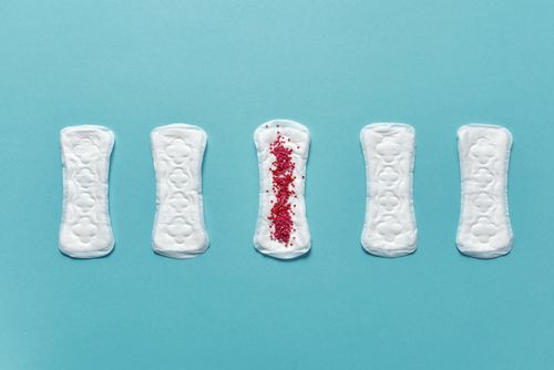 Free Five pantyliners on a blue background illustrating menstruation hygiene. Stock Photo