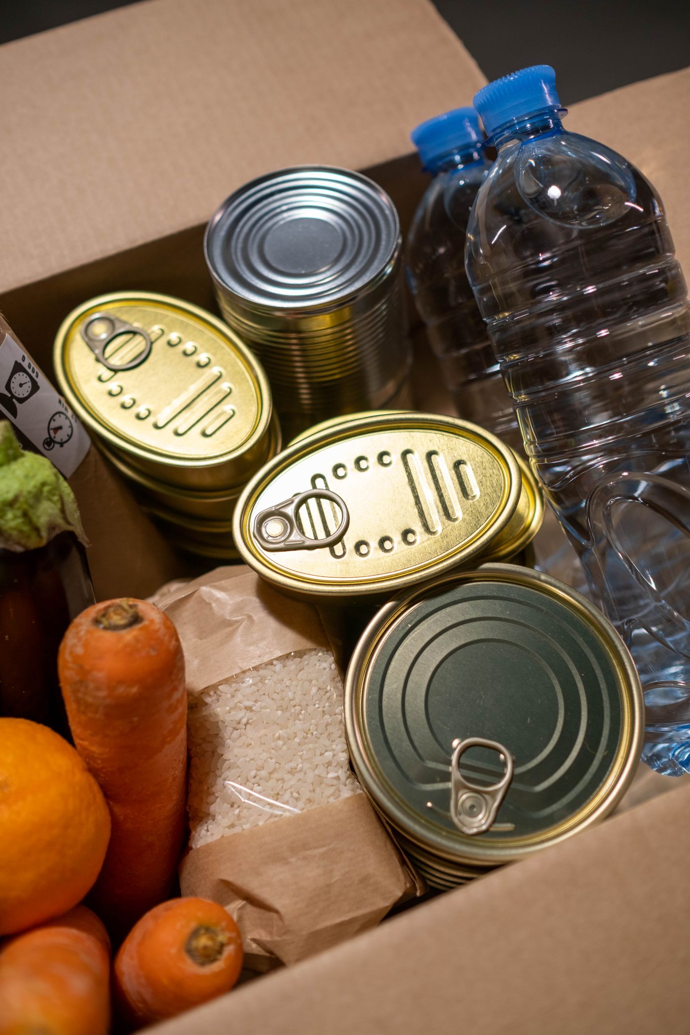 Donation box filled with canned food and fresh produce