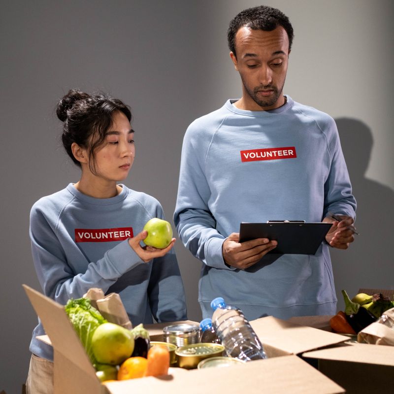 Volunteer organizing donations — placeholder