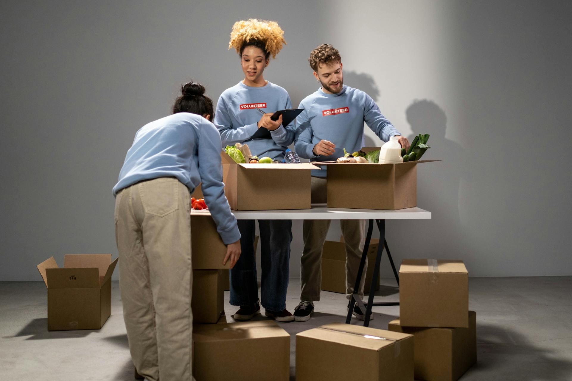 People Preparing Food Rations in the Box