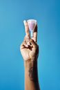 A Person Doing Peace Sign while Holding a Full Menstrual Cup