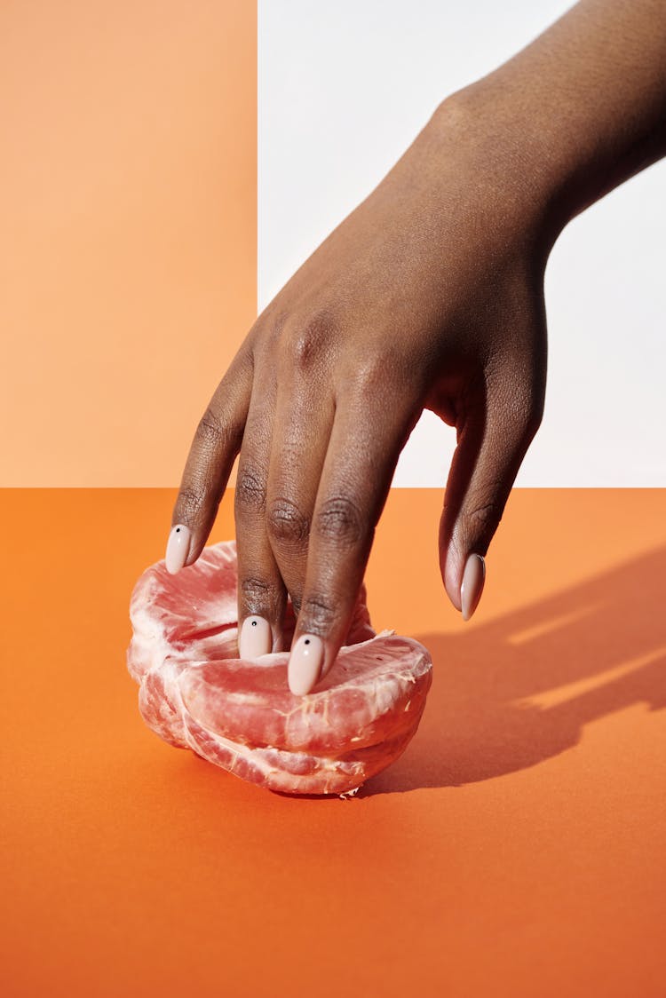 Person Holding Peeled Grapefruit