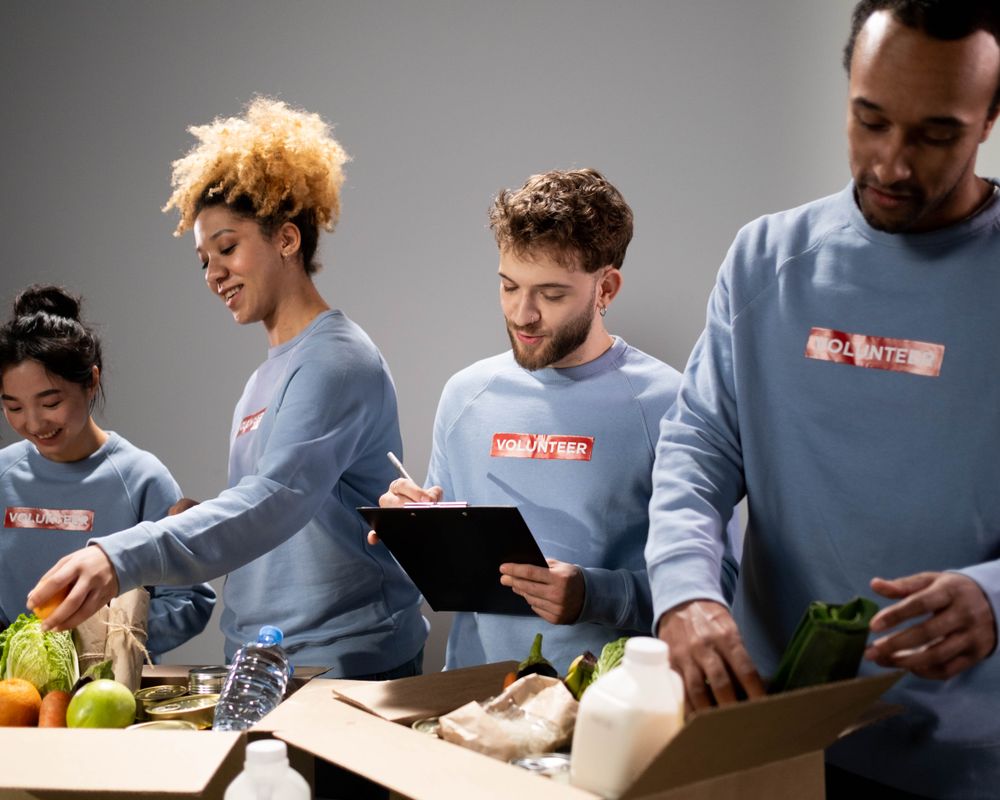 Volunteers packing donations together as a community team